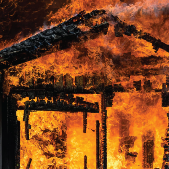 Image shows a building on fire.