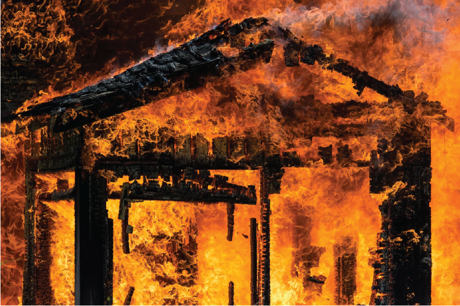 Image shows a building on fire.