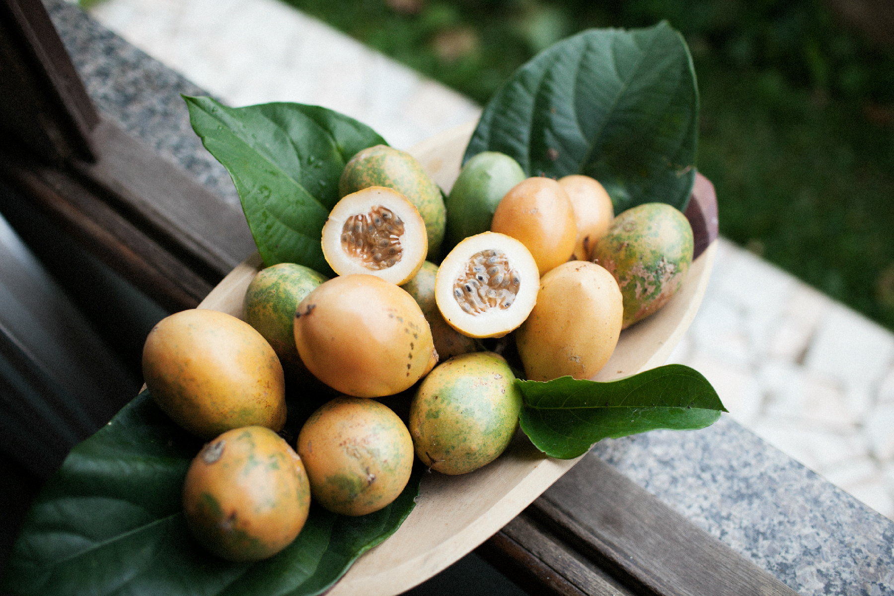 Photo of Freshly harvested passion fruit, revealing its aromatic pulp and jewel-like seeds.” Photo credit - Marcello Aquino via unsplash.com