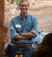 UC Master Gardener David Boucher standing with arms crossed and smiling.